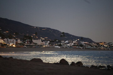Moon reflection on beach at night