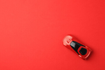 One bright car on red background, top view. Space for text