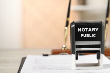 Public notary. Document and stamp on table, closeup. Space for text