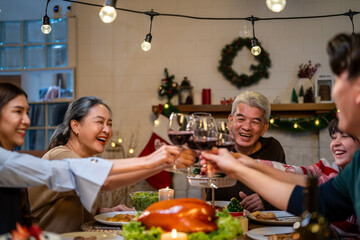 Asian lovely family celebrating christmas party together in house. 