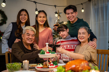 Portrait of Asian family celebrate christmas party together in house. 