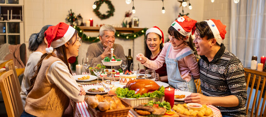 Fototapeta na wymiar Asian lovely family celebrating Christmas party together in house. 