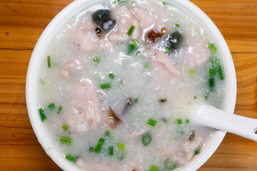 top view porridge with pork and preserved egg
