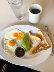 French, toast, fried eggs and avocado
