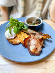 Breakfast with poached eggs and bacon