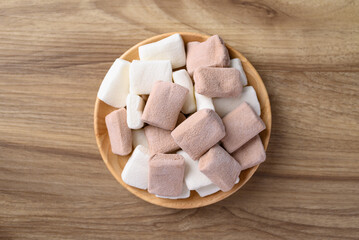 Marshmallow chocolate and vanilla in bowl on wooden background, Table top view