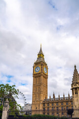 Fototapeta na wymiar Low angle of aged building of famous Big Ben against clock tower located on street of London against blue sky background