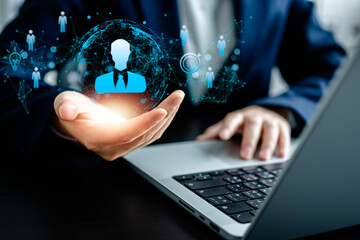 Human Resources Manager holding leader human icons, HRM, CRM, Recruitment Consultant and Human Resources Management Concept, Headhunting Business, development teamwork leadership to arcivement target.