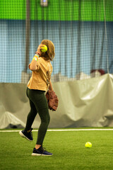 A girl playing softball