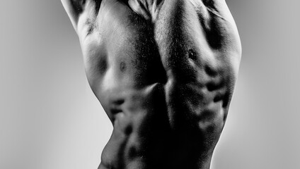 Strong Sexy Athletic Man. Fitness Model showing naked Torso. Cropped photo with naked male body for...