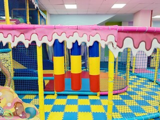Entrance to the labyrinth, children's room in the play Entertainment center. Soft floor, house. Banner active leisure, free time kids photo. Cozy play area, copy space. Daycare for toddler
