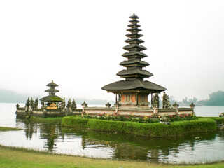 Fototapeta na wymiar Bali, Indonesia - June 22nd 2007: Ulun Danu Beratan Temple, Bedugul. The unique things that most lakes don't have is that there is a temple located right in the middle of the lake