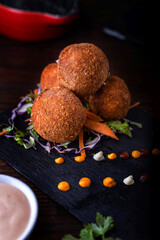 Mushroom Balls with mayonnaise dip served in dish isolated on wooden table side view of arabic food