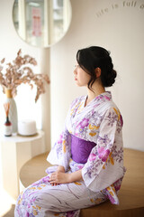 Japanese woman in yukata in coffee shop