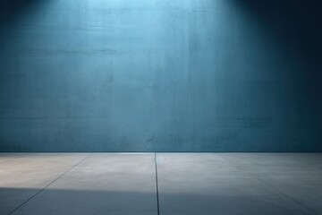 Fototapeta premium The blue concrete wall and floor, adorned with interplay of light and shadow, set a captivating background.
