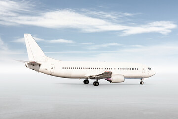 Fototapeta na wymiar White passenger jetliner isolated on bright background with sky