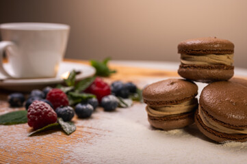 chocolate desserts on a light background close-up, with raspberries and blueberries. Christmas festive background