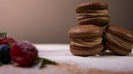 chocolate desserts on a light background close-up, with raspberries and blueberries. Christmas festive background