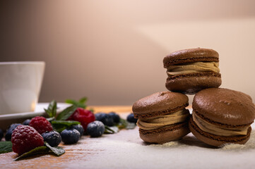 chocolate desserts on a light background close-up, with raspberries and blueberries. Christmas festive background