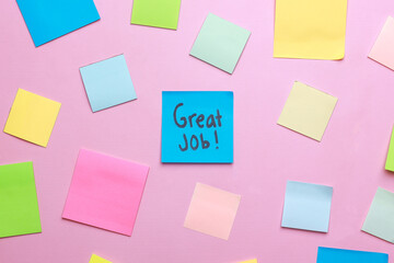 Great Job written on sticky notes over pink background