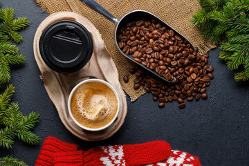 Coffee cup and fir tree branches in cozy setting