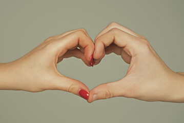 Heart from hands. Love, friendship concept. Man and woman hand in heart form love. Sign heart by...