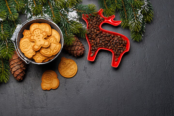 Christmas background with fir tree, gingerbread cookies, nuts, and copy space for greetings