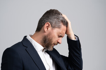 Business man in suit with migraine. Business man got migraine touches head because of pain. Tired exhausted man suffering from headache. Business problems. Head pain migraine. Deadline Dilemmas