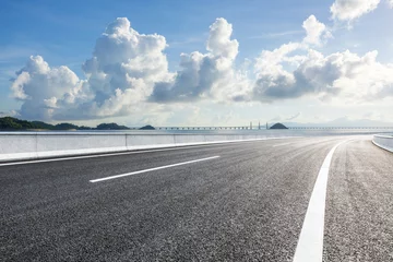 Foto op Canvas Asphalt highway road and beautiful coastline landscape under blue sky © ABCDstock