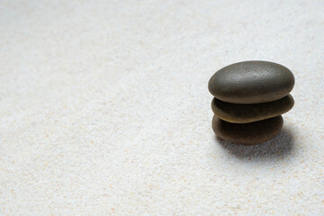 Fototapeta na wymiar Top view of three stones resting on sandstone balance concept, Japanese Zen garden. 