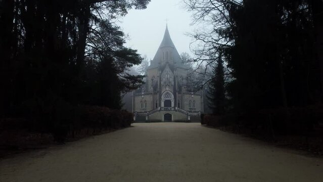 A mysterious and captivating tomb in the morning fog. Czechia.