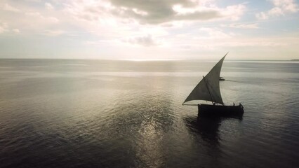 Boat, sailing and drone of sea for travel, summer holiday and adventure or journey on water with sun reflection. Aerial view of yacht on ocean for outdoor tourism, vacation and moving with sunset sky