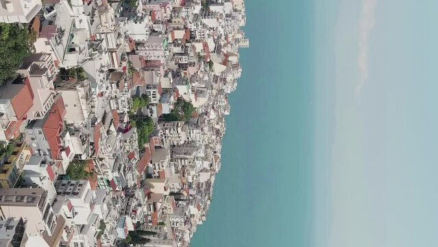 Vertical video. Kavala, Greece. Historic city center. Summer, tourist season, Aerial View
