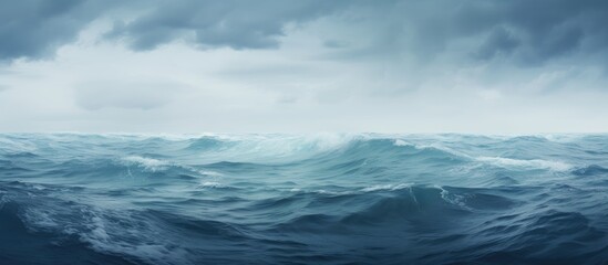 Stunning image captured of vast ocean under overcast sky.