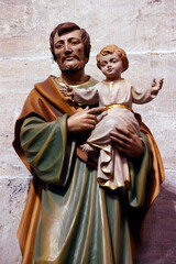  Church of St. Theodule. Saint Josef with infant Jesus in arms. Sion. Switzerland. - obrazy, fototapety, plakaty