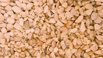 brown abstract background with dry round pebble stones beige