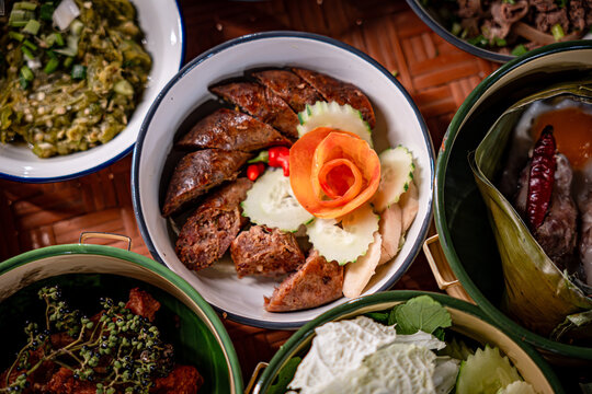 Khantoke, the traditional northern Thai style (Lanna) food with variety of delicious menus such as Nam-prig-Nhum (Green chili dip), local soup, Sai Aua (Thai spicy sausage), crispy pork skin