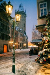 Fototapeta na wymiar Snow winter morning in Prague, Christmas Market