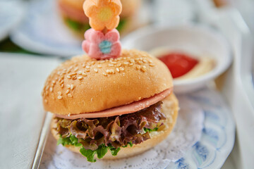 Close-up of homemade cheeseburger serving on plate