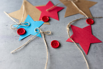flat lay of craft materials paper red buttons and string