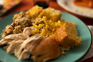 close-up of a spread of thanksgiving dinner on a blue plate
