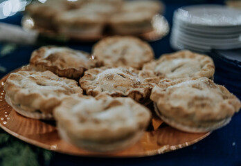 mini homemade pies with sugar on top on a plate
