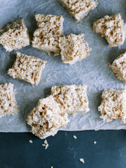 overhead rice krispie treat on parchment and blue background