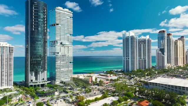 Expensive high-rise hotels and condos on Atlantic ocean shore in Sunny Isles Beach city. American tourism infrastructure in southern Florida