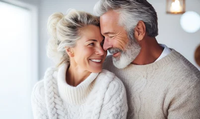 Fotobehang Beautiful professional mature model couple at Valetines day, candid shot of a close up of a very beautiful happy mature couple with opened round eyes wearing knitted sweater  © hisilly