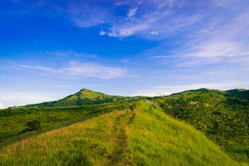 Fototapeta premium Landscape with mountains and blue sky. Cabaliwan Peak, Romblon, Philippines.
