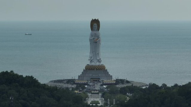 Aerial footage of Guanyin statue at seaside in nanshan temple, hainan island , China