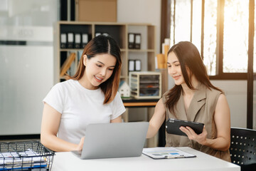 Portrait of success business people working together in office. Couple teamwork startup concept.