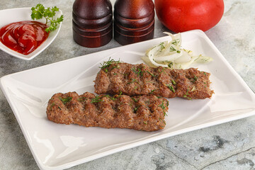 Kebab with beef served onion