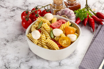 Italian pasta with mozzarella and tomato